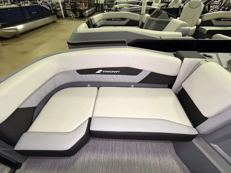 Slide: The Image of The image shows the seating area of a 2027 Starcraft VX 20 Q DH with gray upholstery. - 7