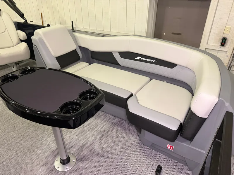Slide: The Image of The 2027 Starcraft VX 20 Q DH features a sleek, cushioned seating area with an integrated table. - 6