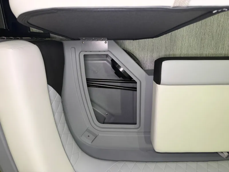 Slide: The Image of Close-up of a seating area with storage in a Starcraft VX 20 Q DH boat. - 12