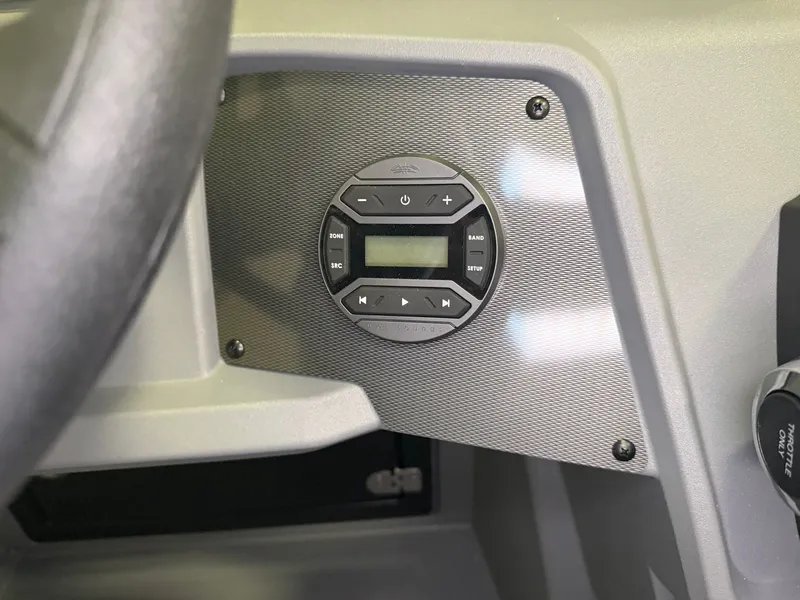 Slide: The Image of Close-up of a helm console featuring a round control panel with multiple buttons. - 19