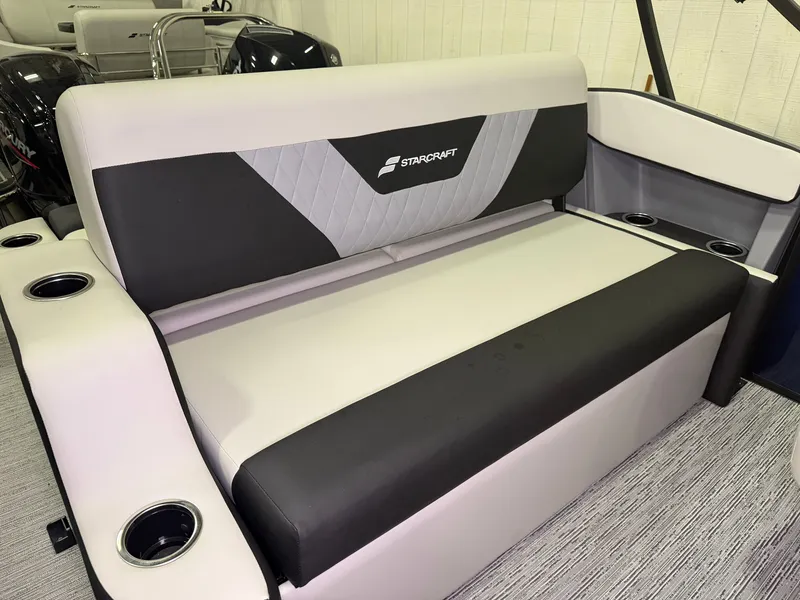 Slide: The Image of The 2027 Starcraft VX 20 Q DH features a modern, comfortable bench seat with cup holders. - 24
