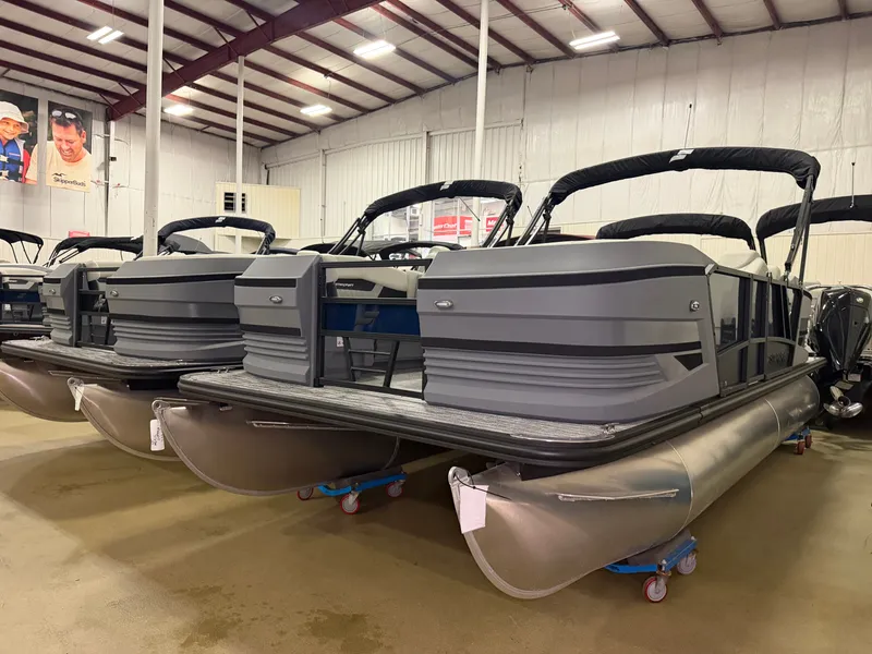 Slide: The Image of Starcraft VX 20 Q DH 2027 pontoon boat in a warehouse setting. - 1