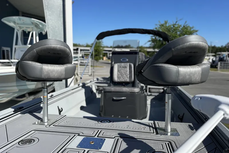 Slide: The Image of 2026 Avid 20 Rogue CC boat interior with two cushioned seats and sleek design. - 12
