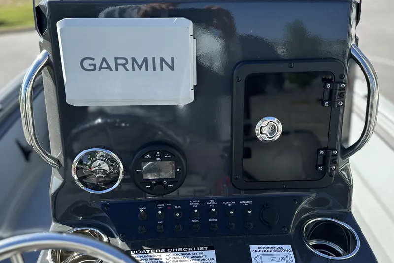 Slide: The Image of Console of 2026 Avid 20 Rogue CC boat with Garmin navigation system. - 13