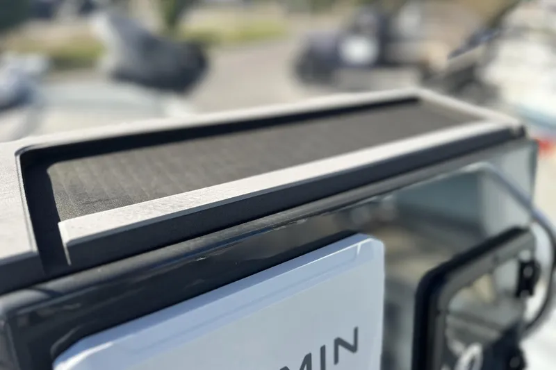 Slide: The Image of Close-up of a 2026 Avid 20 Rogue CC boat dashboard with Garmin device. - 16