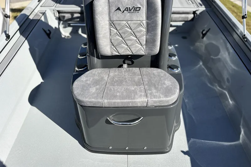 Slide: The Image of Interior of 2026 Avid 20 Rogue CC boat with cushioned seating. - 18
