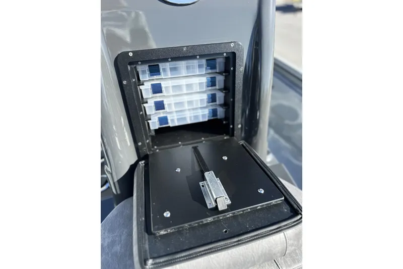Slide: The Image of Storage compartment with tackle boxes in 2026 Avid 20 Rogue CC boat. - 19