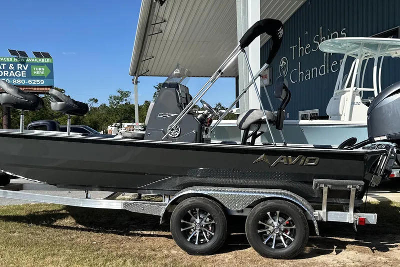 Slide: The Image of 2026 Avid 20 Rogue CC boat on trailer outside dealership. - 3