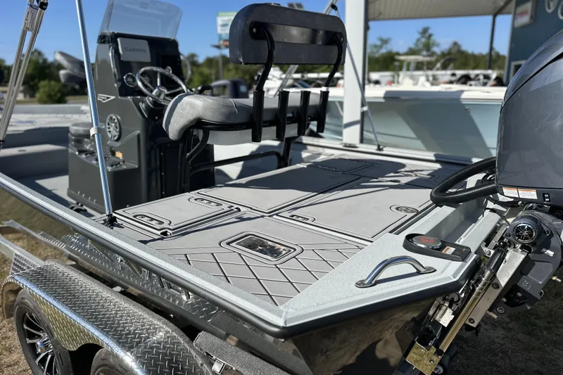 Slide: The Image of Avid 20 Rogue CC 2026 boat interior with steering console and seating. - 7
