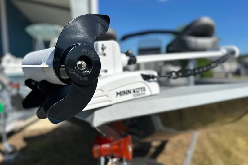 Slide: The Image of Avid 20 Rogue CC 2026 boat with Minn Kota trolling motor, close-up view. - 8