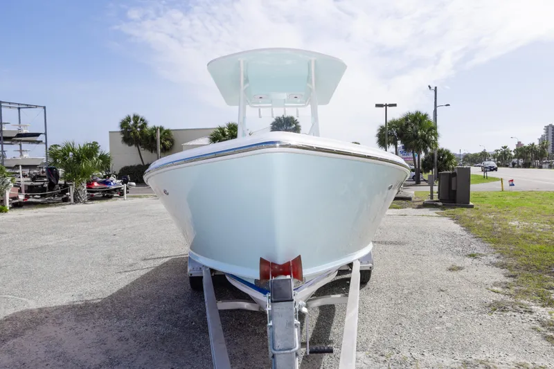 Slide: The Image of 2026 Albury Brothers 23 Forward Seating boat on trailer, parked outdoors. - 13