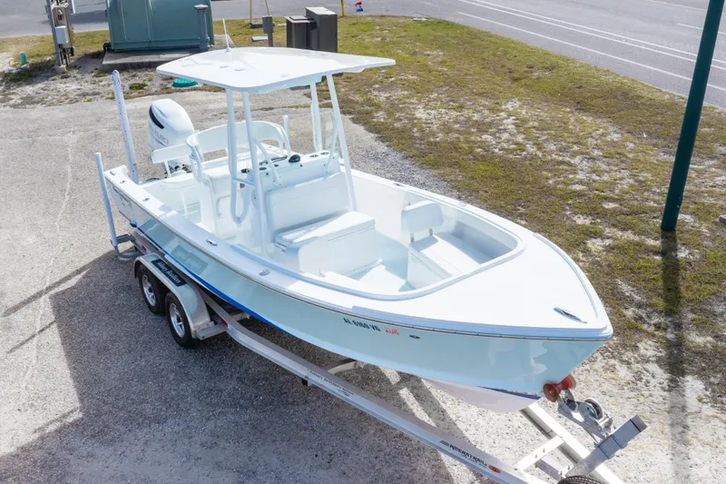 Slide: The Image of 2026 Albury Brothers 23 Forward Seating boat on trailer, parked outdoors. - 17