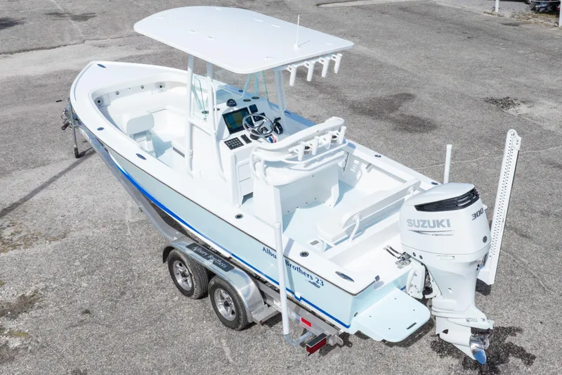 Slide: The Image of 2026 Albury Brothers 23 Forward Seating boat with Suzuki 300 engine on trailer. - 2