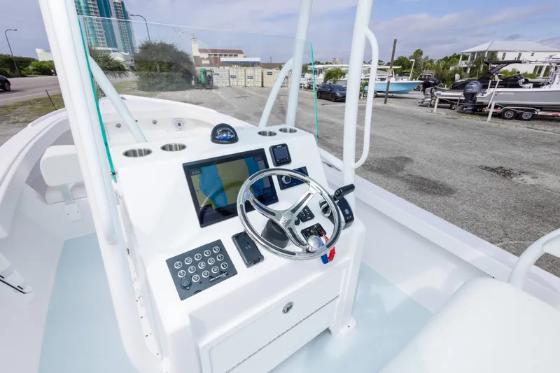 Slide: The Image of 2026 Albury Brothers 23 Forward Seating boat dashboard with modern controls and navigation system. - 22