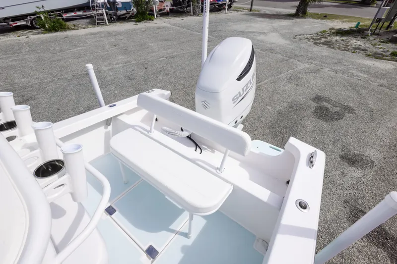 Slide: The Image of 2026 Albury Brothers 23 Forward Seating boat with Suzuki outboard motor, docked on gravel. - 29