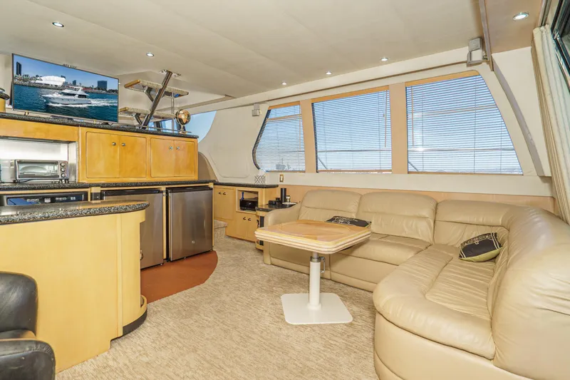 Slide: The Image of Luxurious interior of 1999 Carver 530 Voyager Pilothouse with leather seating and modern amenities. - 16