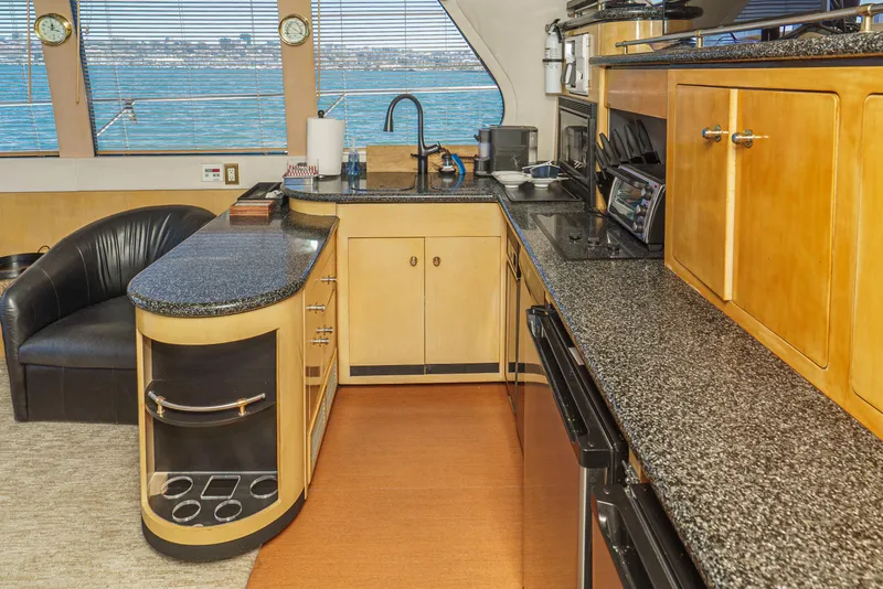Slide: The Image of Luxurious kitchen interior of 1999 Carver 530 Voyager Pilothouse yacht with ocean view. - 17