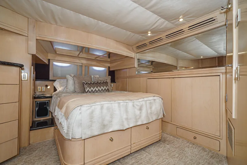 Slide: The Image of Luxurious bedroom interior of 1999 Carver 530 Voyager Pilothouse yacht with elegant wood finish. - 20