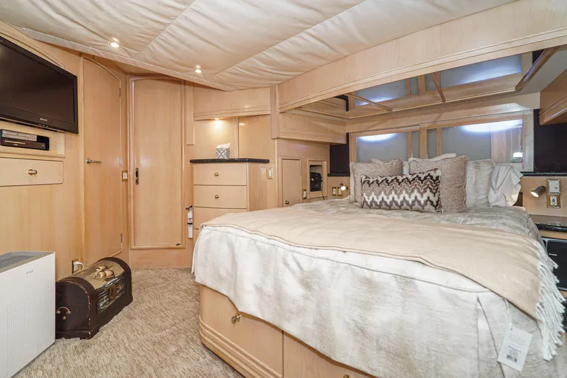 Slide: The Image of Luxurious bedroom interior of 1999 Carver 530 Voyager Pilothouse yacht with elegant decor. - 21