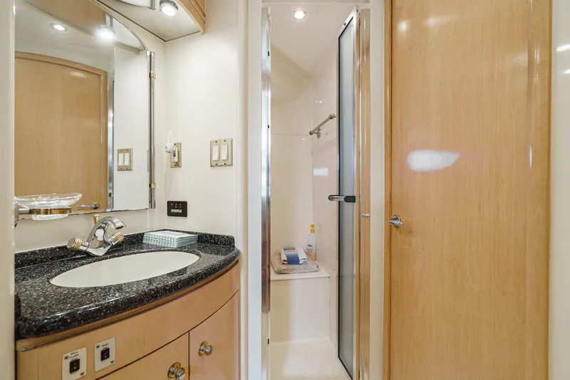 Slide: The Image of Luxurious bathroom in 1999 Carver 530 Voyager Pilothouse yacht with modern fixtures. - 24