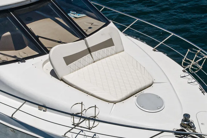 Slide: The Image of 1999 Carver 530 Voyager Pilothouse yacht with cushioned sun deck on blue water. - 33