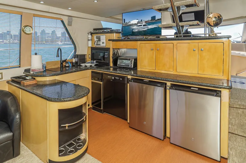 Slide: The Image of Luxurious kitchen interior of 1999 Carver 530 Voyager Pilothouse yacht with modern appliances. - 40
