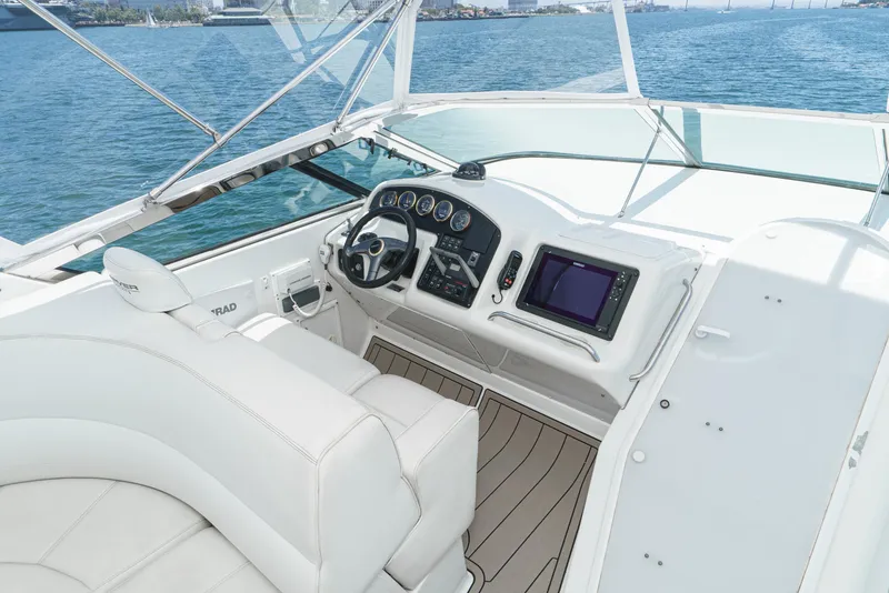 Slide: The Image of 1999 Carver 530 Voyager Pilothouse helm with modern controls and ocean view. - 5