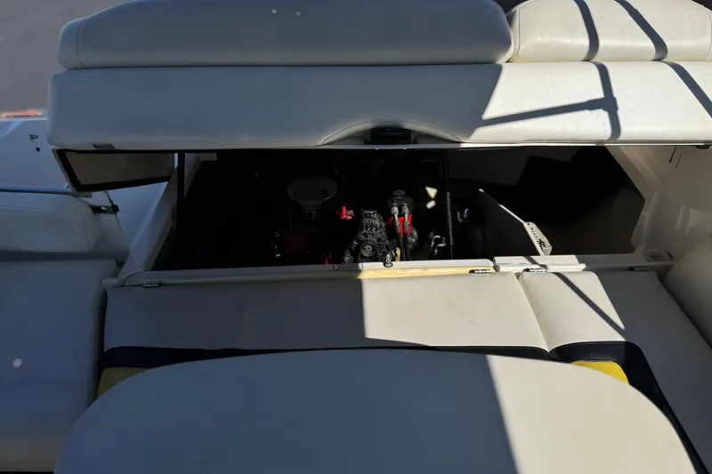 Slide: The Image of 2005 Regal 2200 Bowrider engine compartment with open hatch, showcasing interior components. - 18