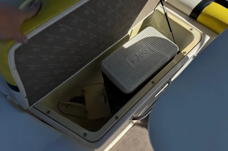 Slide: The Image of Open storage compartment in 2005 Regal 2200 Bowrider with Igloo cooler inside. - 22