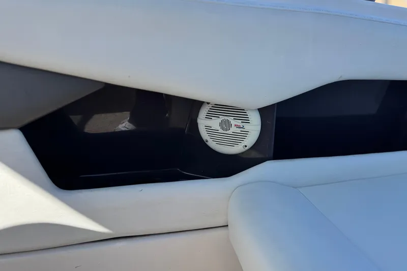 Slide: The Image of Speaker system in a 2005 Regal 2200 Bowrider boat interior. - 24