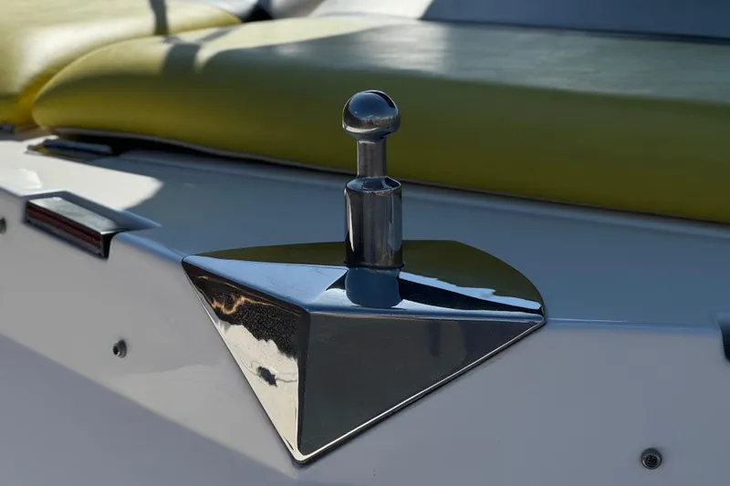 Slide: The Image of Close-up of a 2005 Regal 2200 Bowrider boat cleat with green seating. - 8