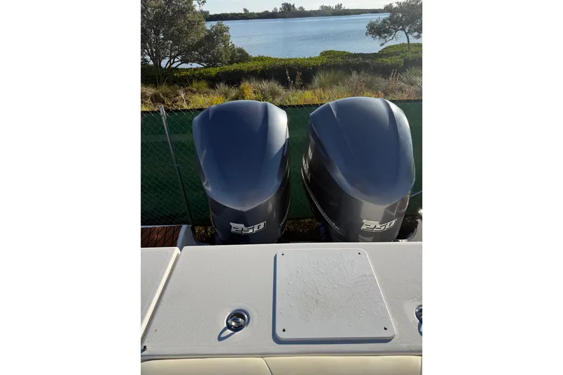 Slide: The Image of Twin 250 horsepower engines on a 2017 Tidewater 280 CC Adventure boat. - 11