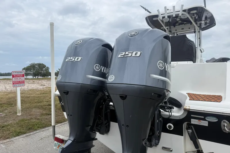 Slide: The Image of 2017 Tidewater 280 CC Adventure with twin Yamaha 250 engines at a dockside. - 12
