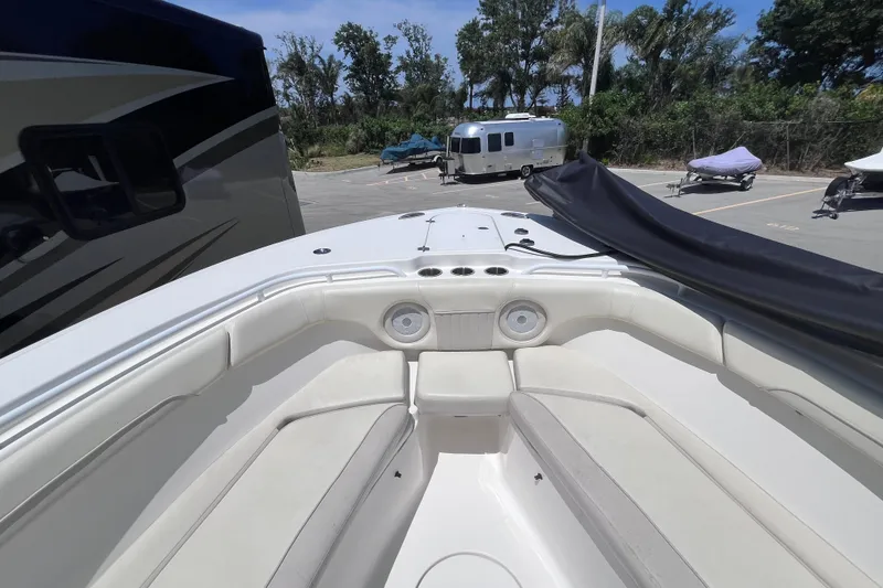 Slide: The Image of 2017 Tidewater 280 CC Adventure boat interior with seating and cup holders. - 16