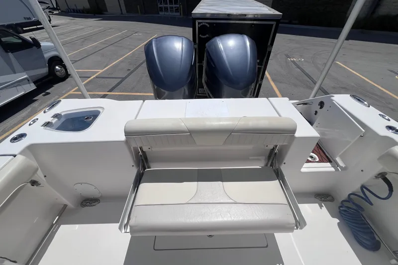 Slide: The Image of 2017 Tidewater 280 CC Adventure boat with dual engines and seating area. - 21