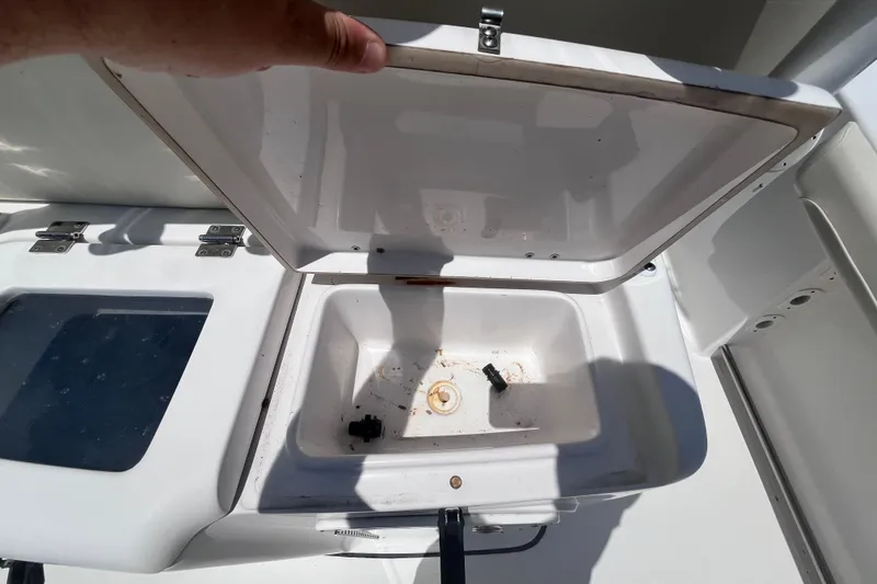 Slide: The Image of Open storage compartment on a 2017 Tidewater 280 CC Adventure boat. - 27