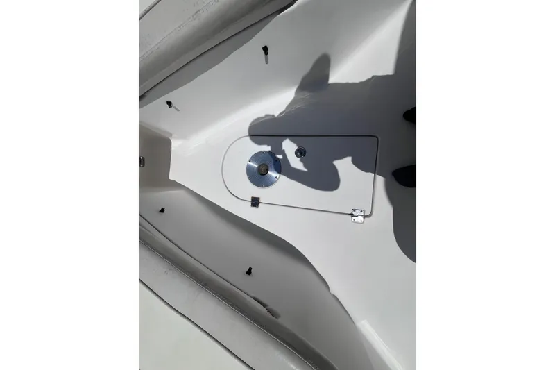 Slide: The Image of 2017 Tidewater 280 CC Adventure boat deck with storage hatch and shadow. - 30