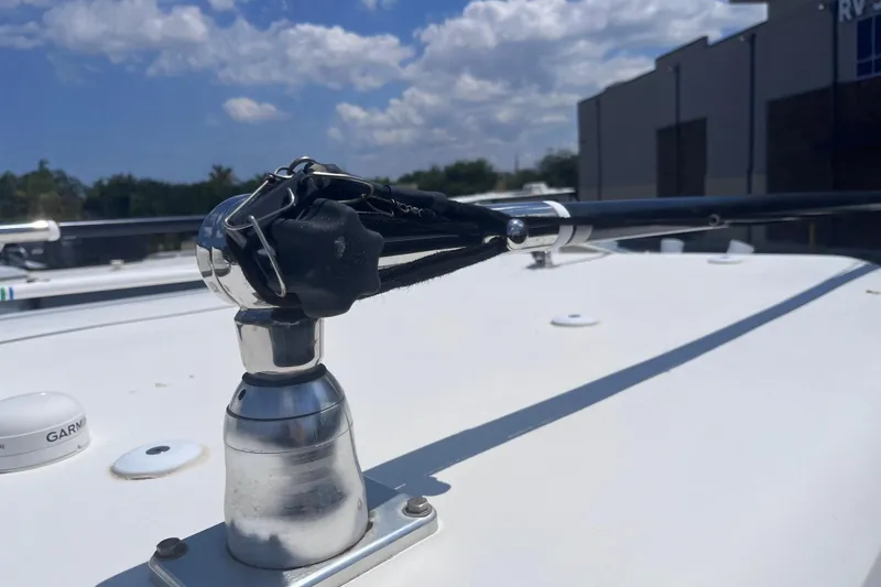 Slide: The Image of Antenna mount on 2017 Tidewater 280 CC Adventure boat under blue sky. - 33