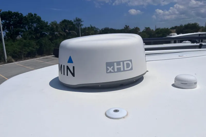 Slide: The Image of Garmin xHD radar on 2017 Tidewater 280 CC Adventure boat under blue sky. - 34