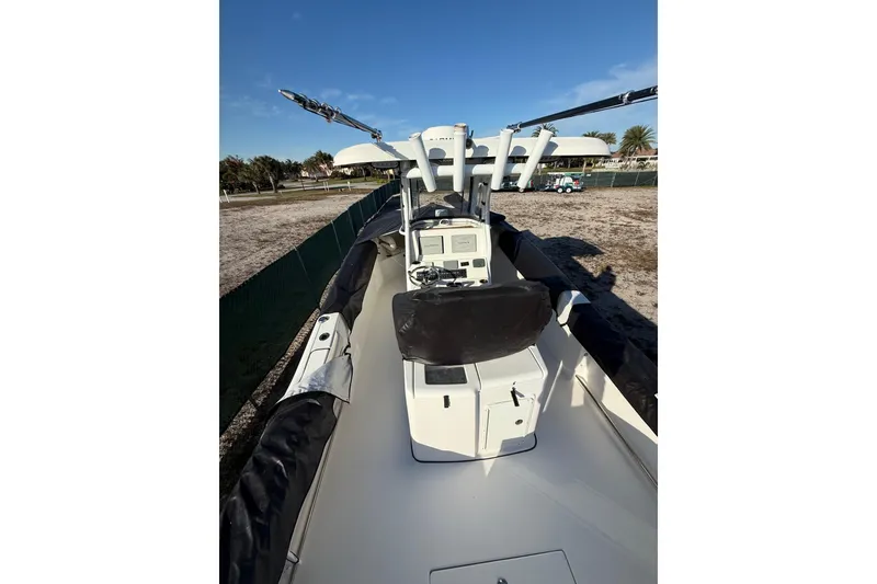 Slide: The Image of 2017 Tidewater 280 CC Adventure boat, center console view, parked on dry land. - 4