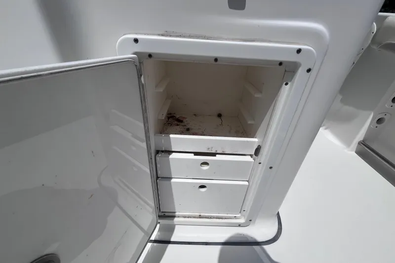 Slide: The Image of Open storage compartment on a 2017 Tidewater 280 CC Adventure boat. - 41