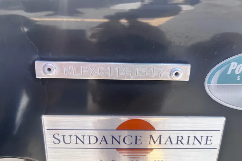 Slide: The Image of 2017 Tidewater 280 CC Adventure boat with serial number plate and Sundance Marine logo. - 44