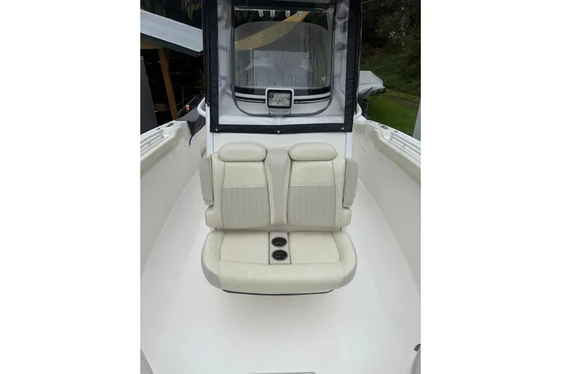 Slide: The Image of 2017 Tidewater 280 CC Adventure boat with cushioned seating and cup holders. - 9