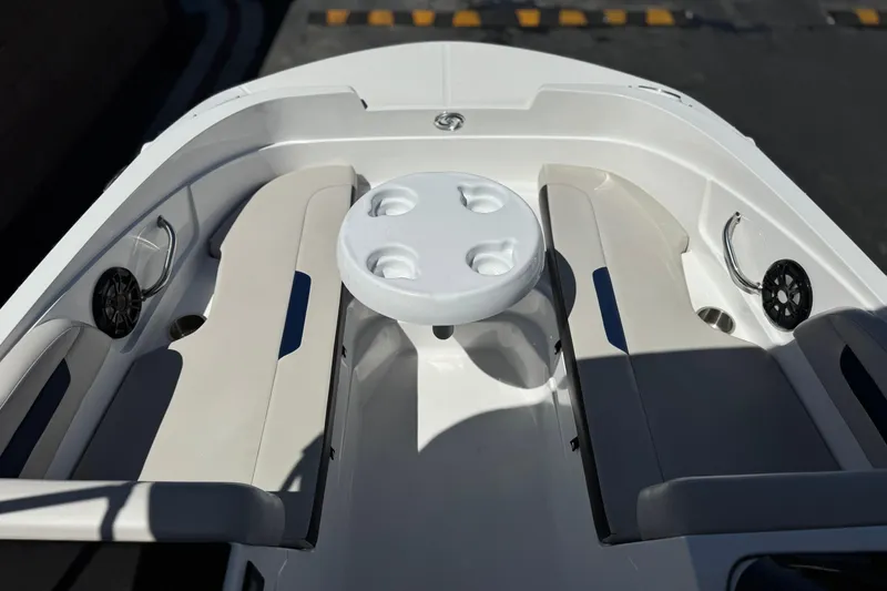 Slide: The Image of 2022 Hurricane SunDeck Sport 185 OB boat interior with seating and table. - 11