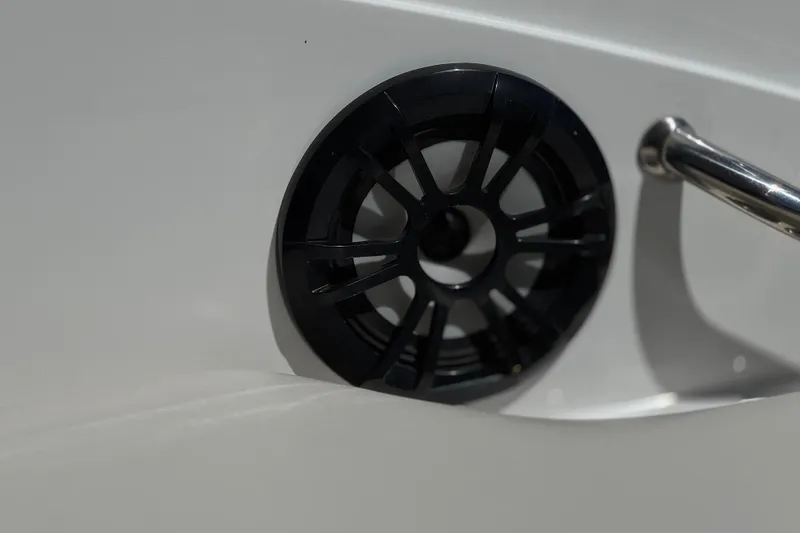Slide: The Image of Close-up of a 2022 Hurricane SunDeck Sport 185 OB boat speaker and handle. - 16