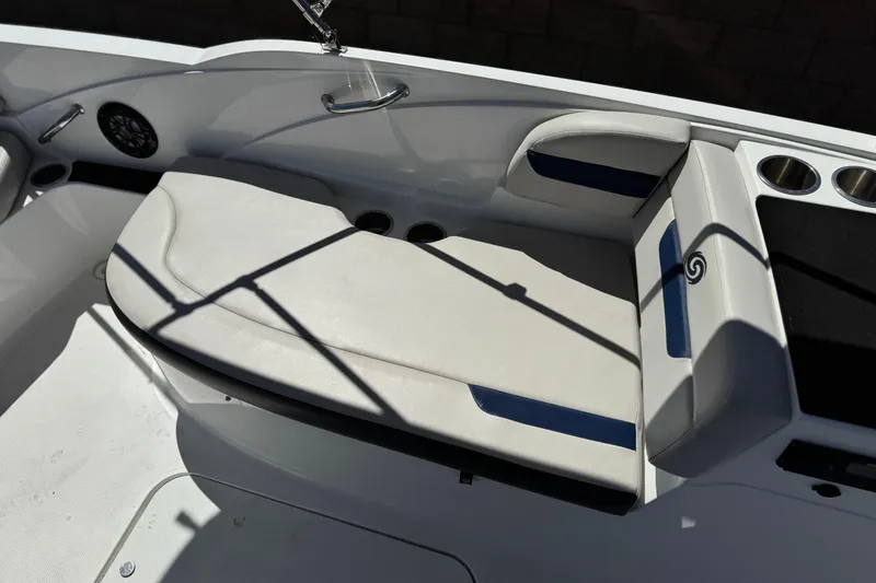 Slide: The Image of 2022 Hurricane SunDeck Sport 185 OB boat seating area with cup holders and speaker. - 17