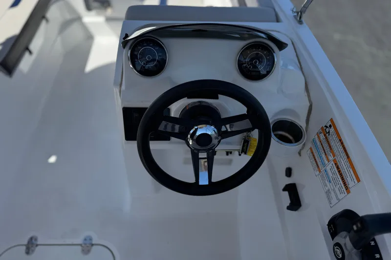 Slide: The Image of Steering console of 2022 Hurricane SunDeck Sport 185 OB boat with gauges and controls. - 23
