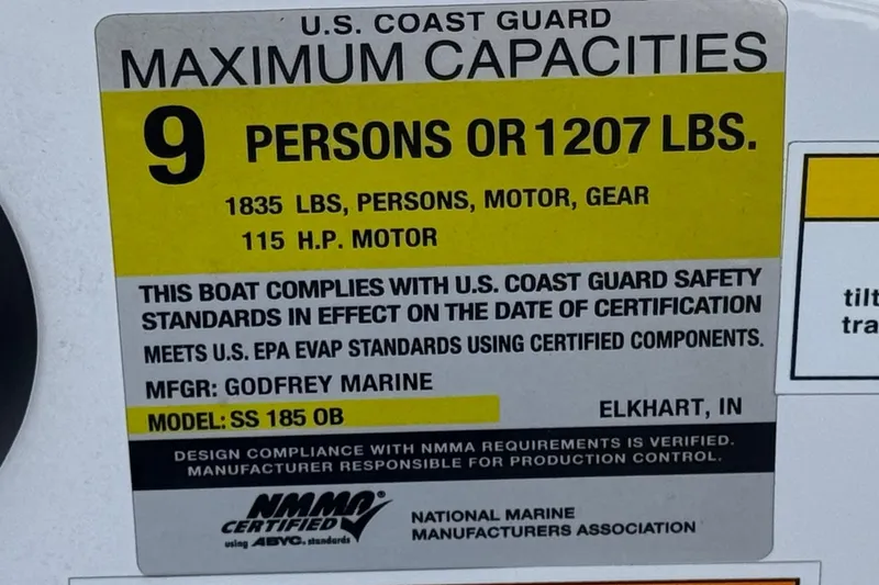 Slide: The Image of 2022 Hurricane SunDeck Sport 185 OB capacity label: 9 persons or 1207 lbs, 115 HP motor. - 27