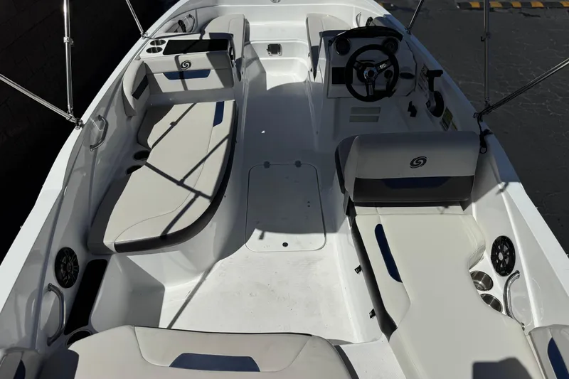 Slide: The Image of 2022 Hurricane SunDeck Sport 185 OB boat interior with seating and steering wheel. - 8
