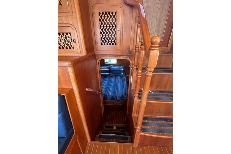 Slide: The Image of Interior of 2007 Heritage East Sundeck Trawler with wooden stairs and cabin view. - 11